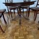 Round mahogany table and beech chairs.