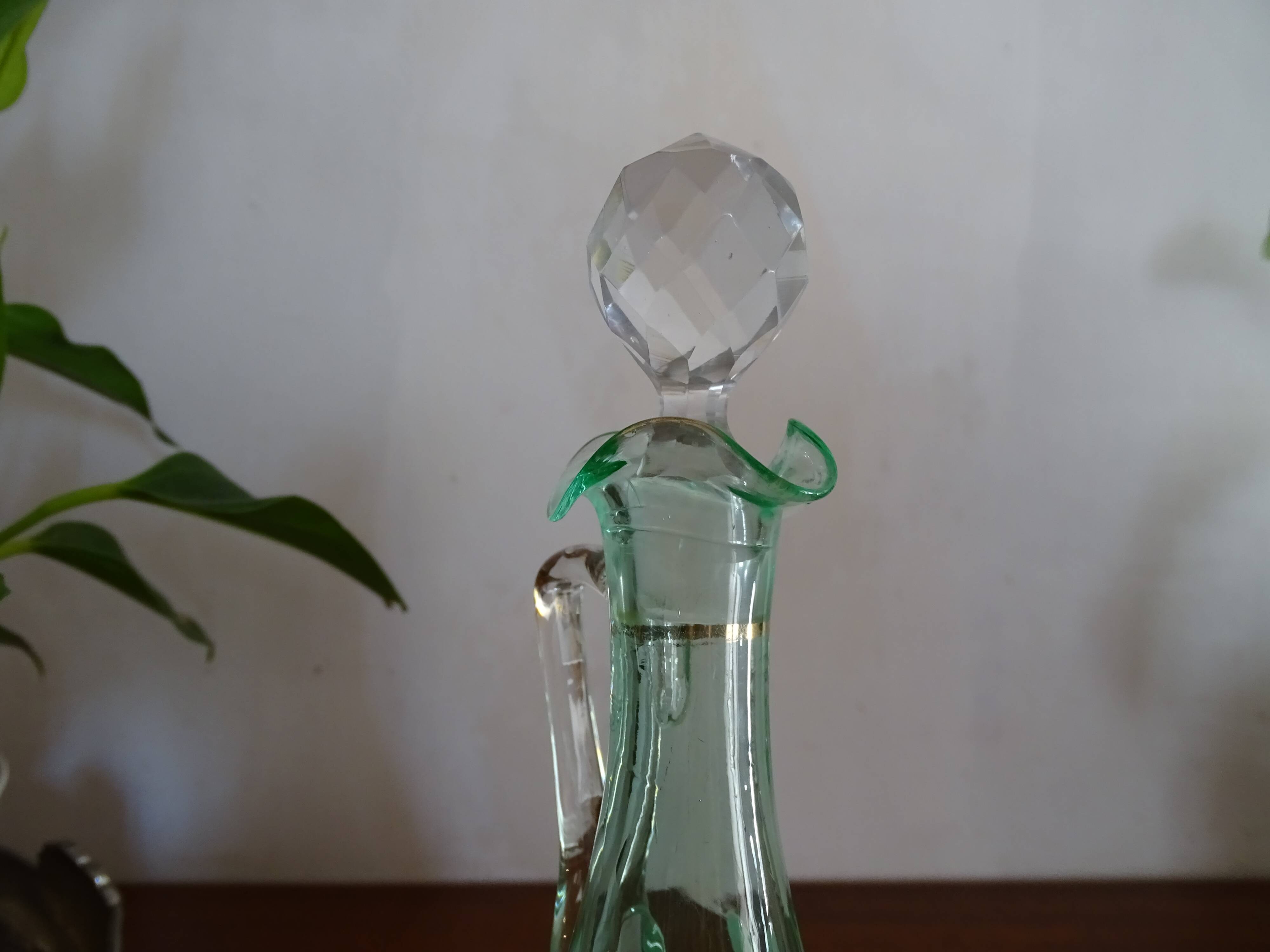 Old carafe enamelled with glass flowers