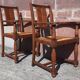 Pair of oak armchairs with straw seats and backs.