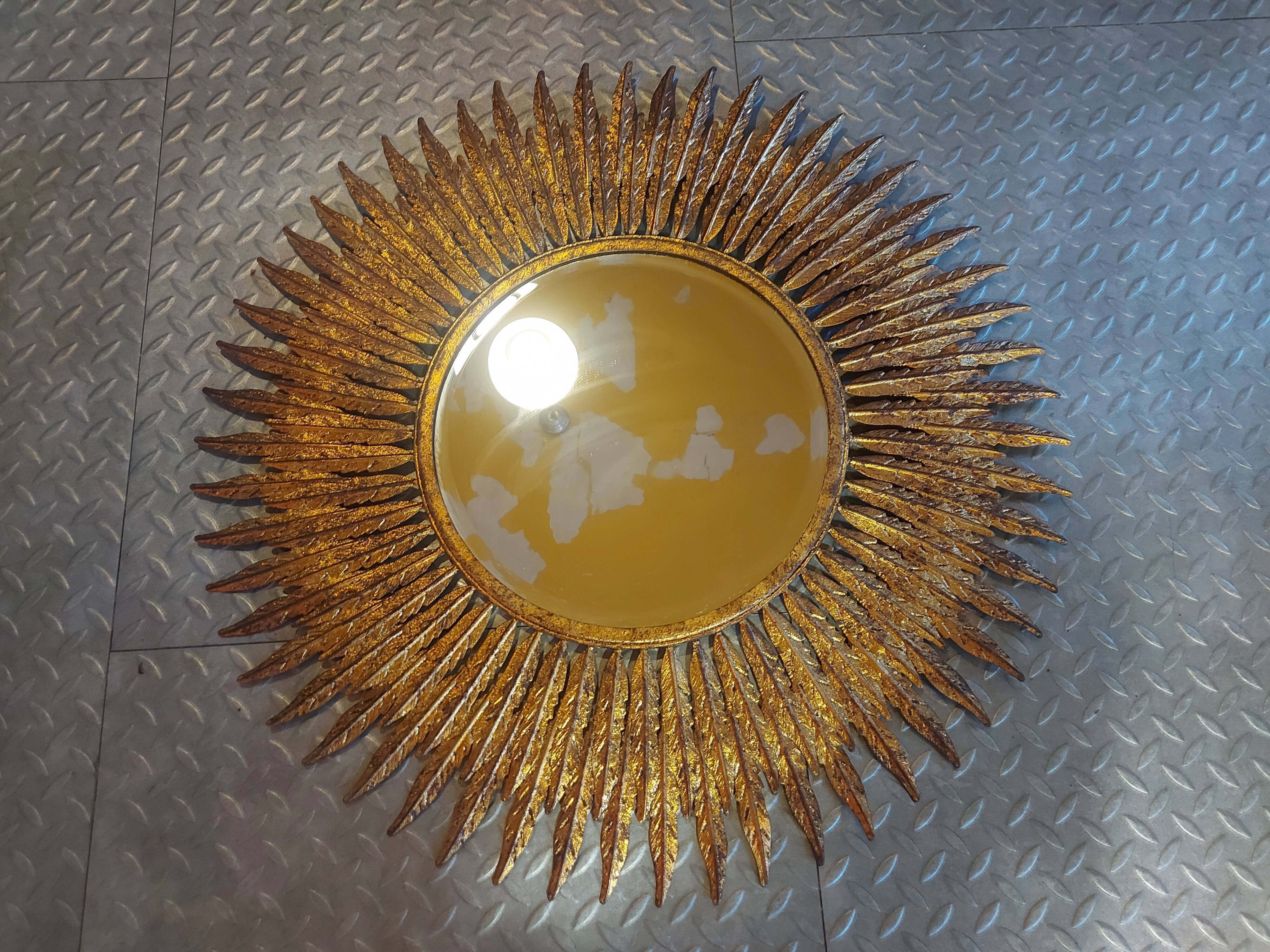 Miroir soleil en métal doré 62cm