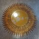 Miroir soleil en métal doré 62cm