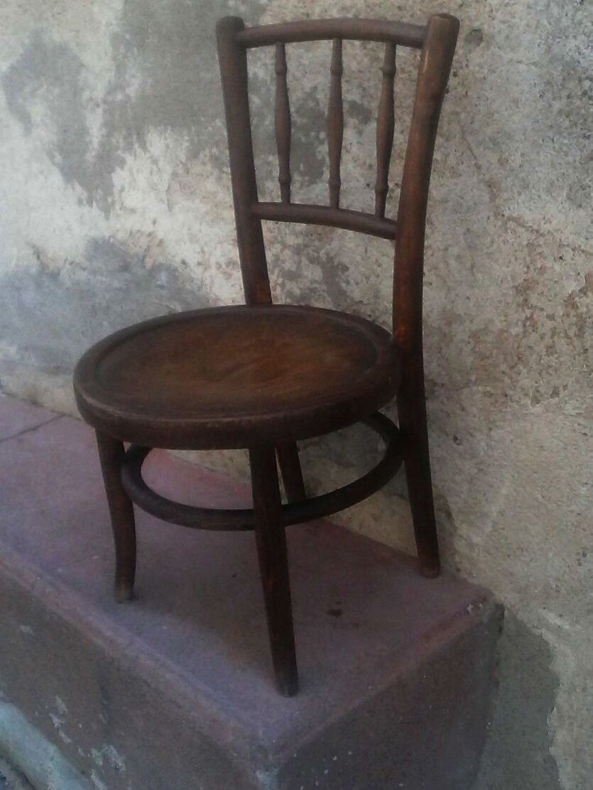 Antique children's chair in curved wood