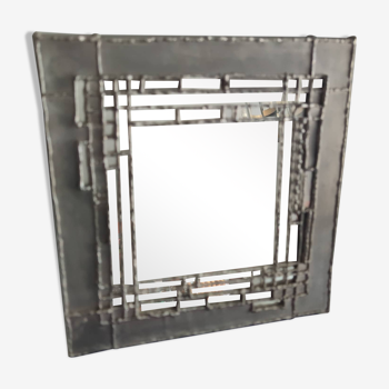 Tin mirror on brutalist wood support