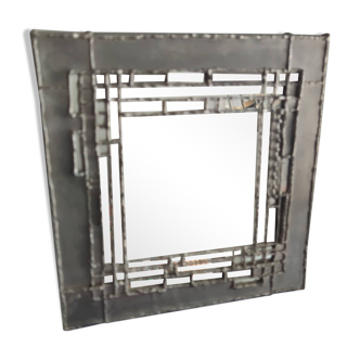 Tin mirror on brutalist wood support