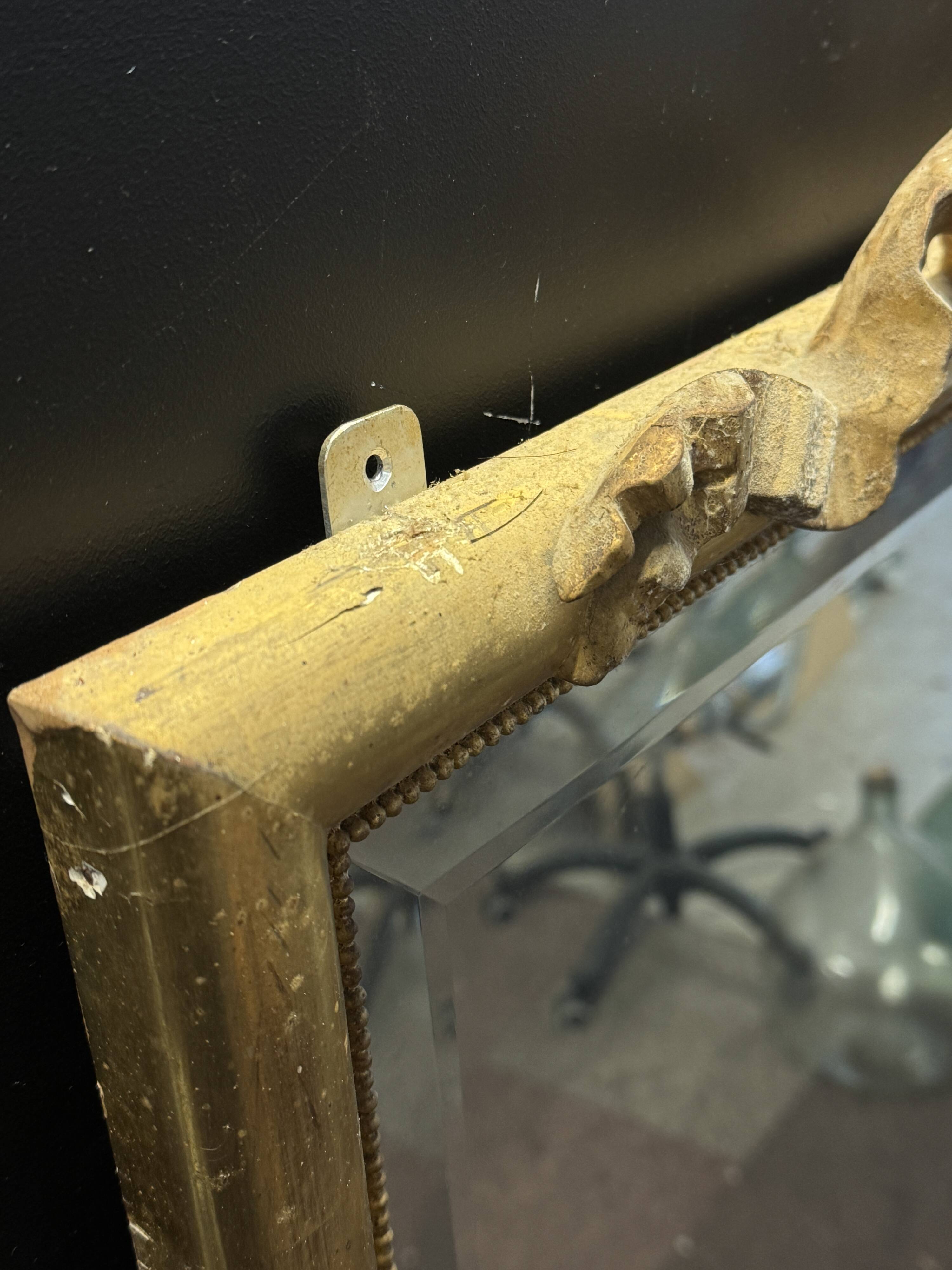 Large mirror with a gold frame