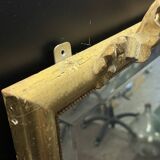 Large mirror with a gold frame