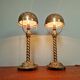 Pair of bronze and brass table lamps, early 20th century