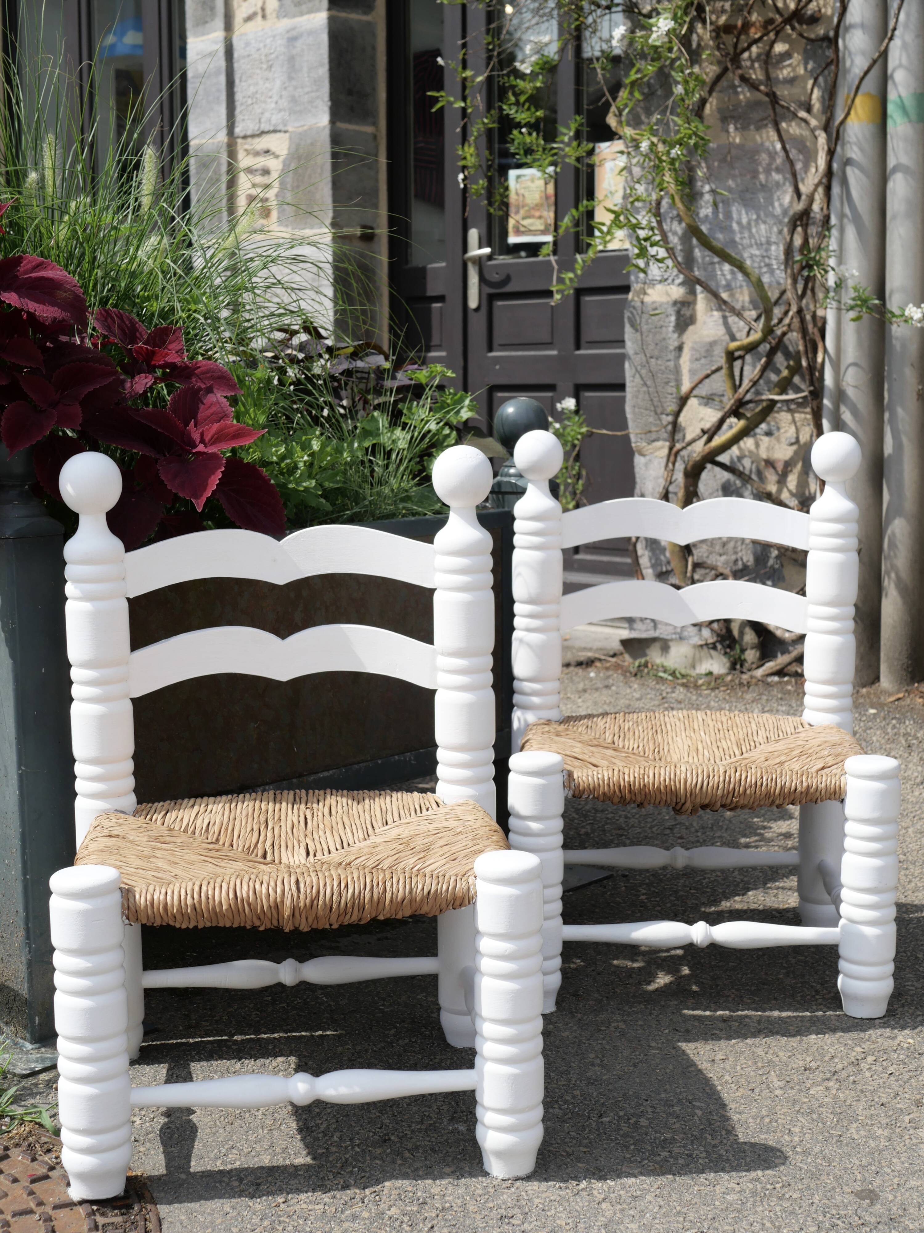 Pair of rush-seated chairs by Charles Dudouyt