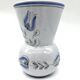 Blue glazed earthenware vase – stylized floral decoration – signed on the base