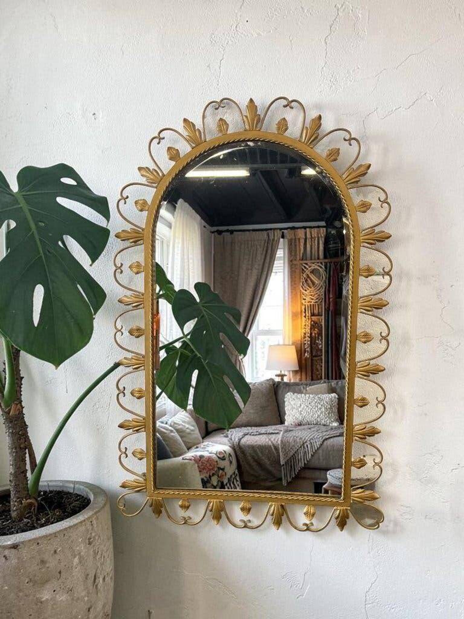 Vintage gold wall mirror with leaves