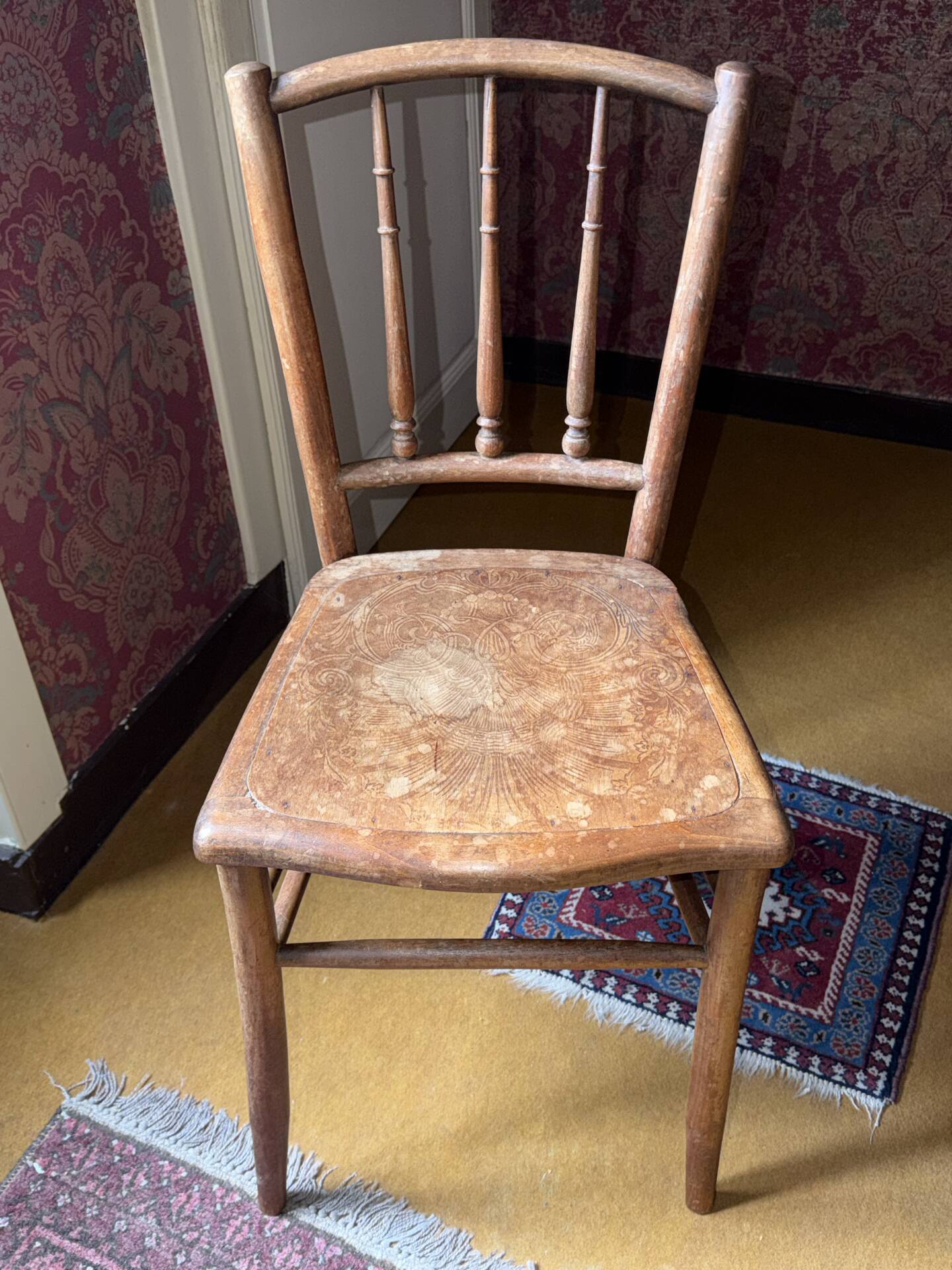 Old wooden bistro chair – decorated seat – rustic furniture