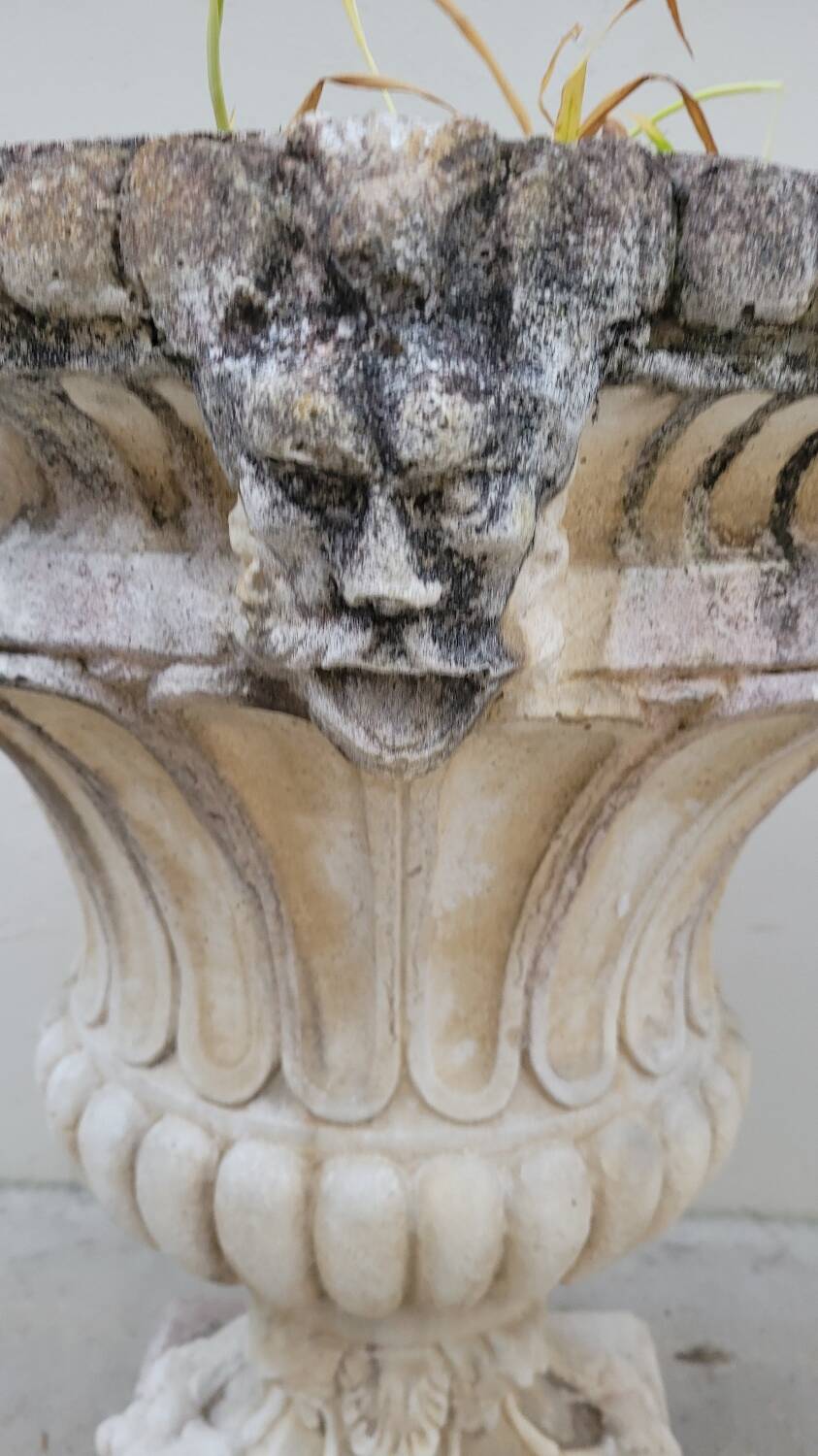 Pair of planter vases decorated with faces in reconstituted stone 1950s
