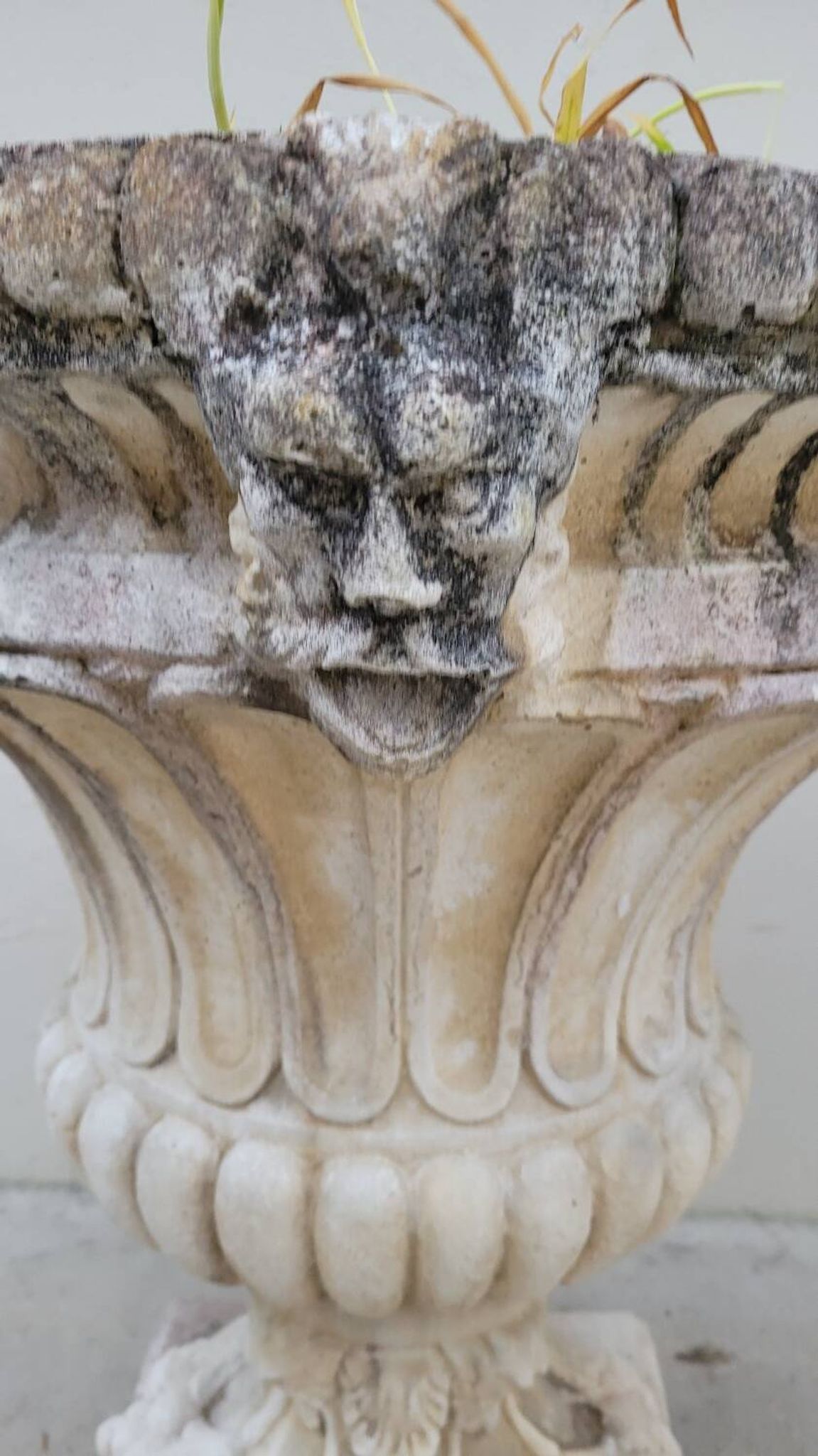 Pair of planter vases decorated with faces in reconstituted stone 1950s