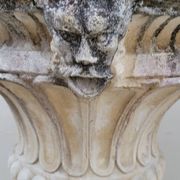 Pair of planter vases decorated with faces in reconstituted stone 1950s