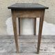 Old kitchen table in wood with compass feet