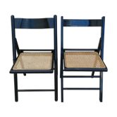 Pair of folding chairs in blackened wood and canne seat