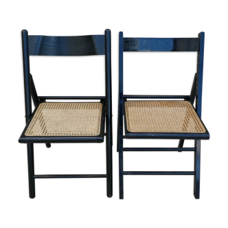 Pair of folding chairs in blackened wood and canne seat