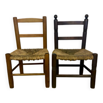 Pair of old wooden and straw children's chairs.