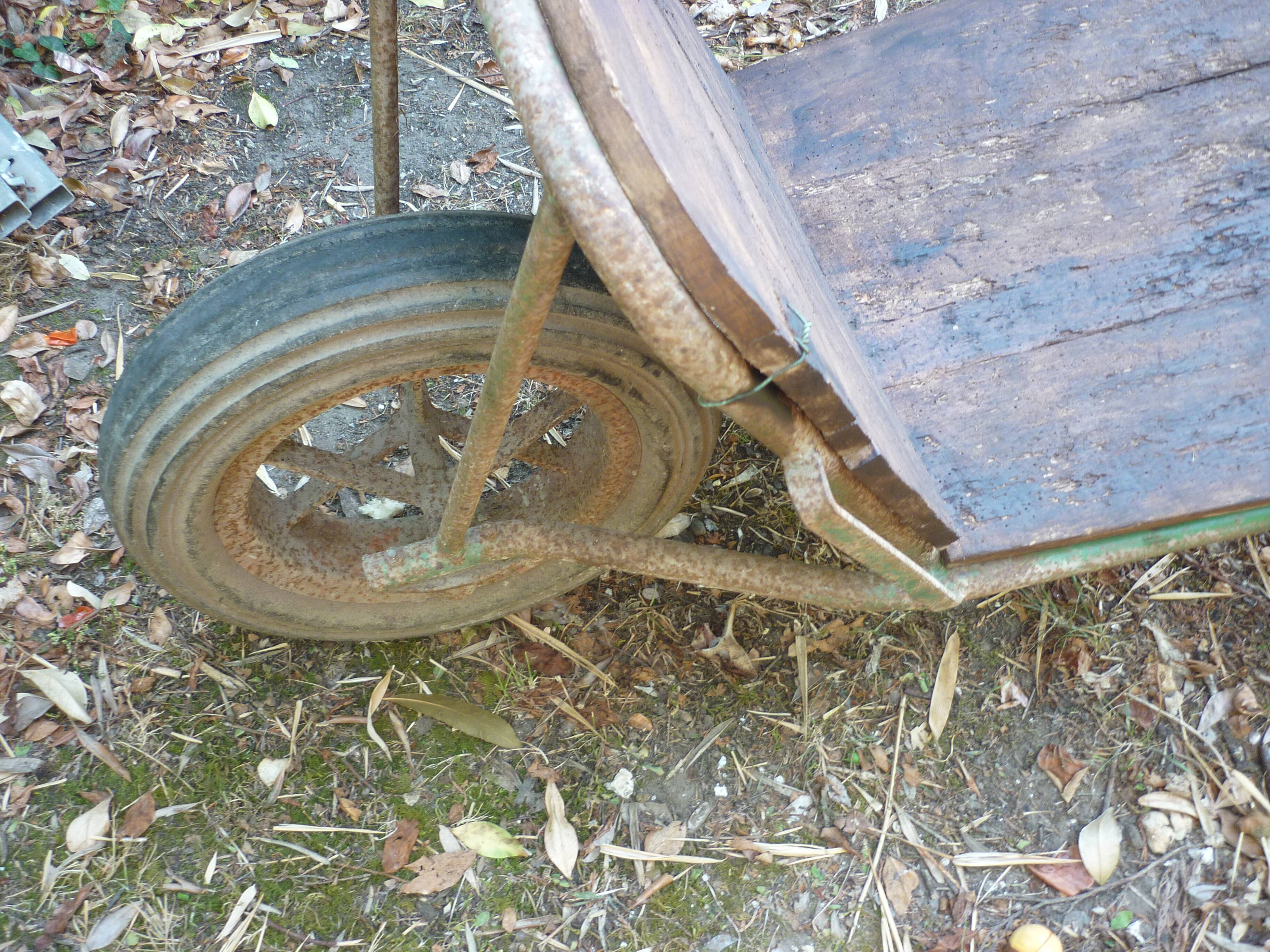 Former wooden and metal wheelbarrow