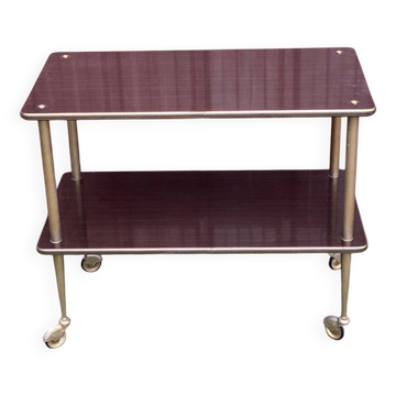 Brown rosewood rolling table with gold fluted legs