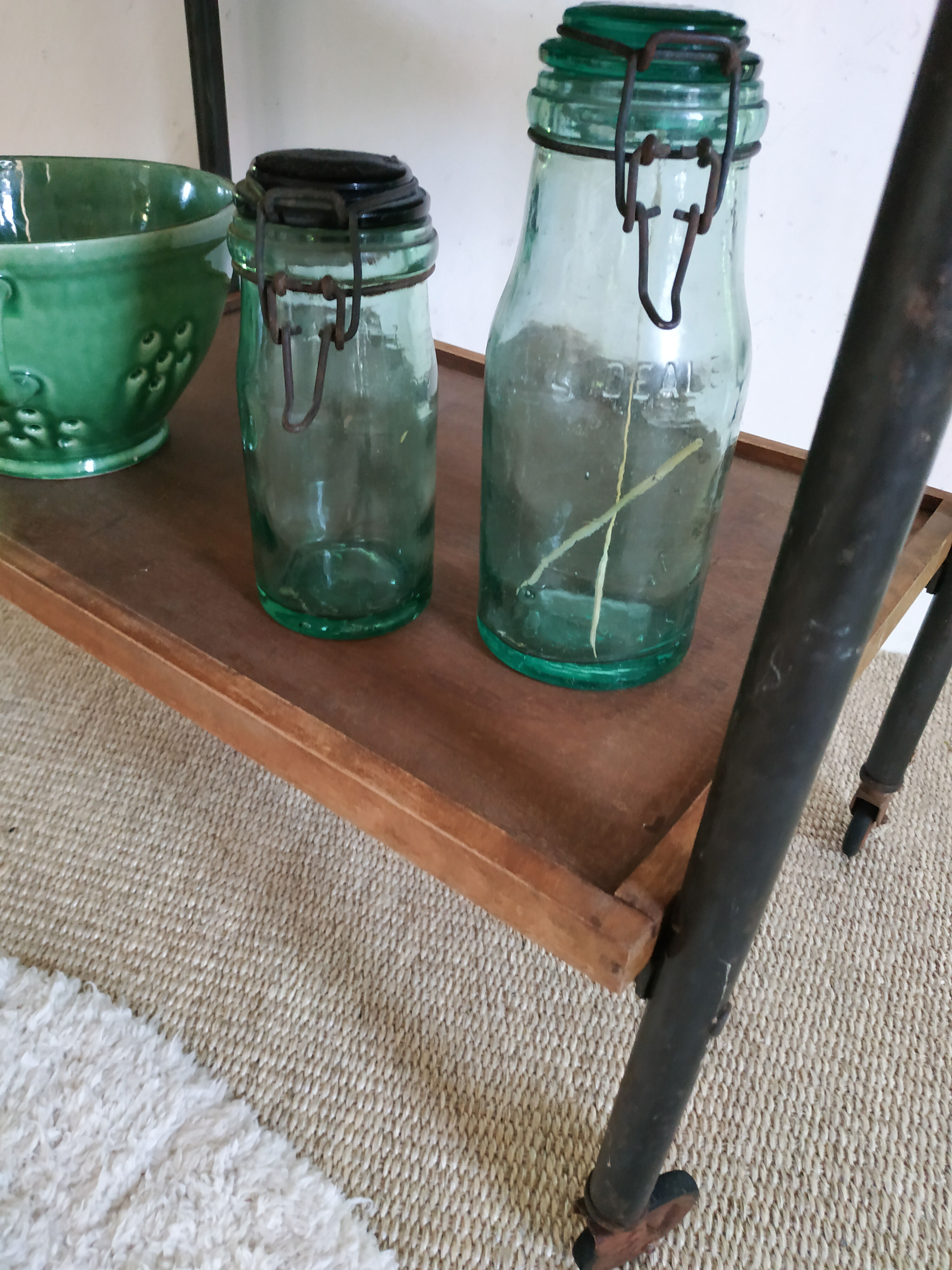 Serving table on metal wheels and antique wood