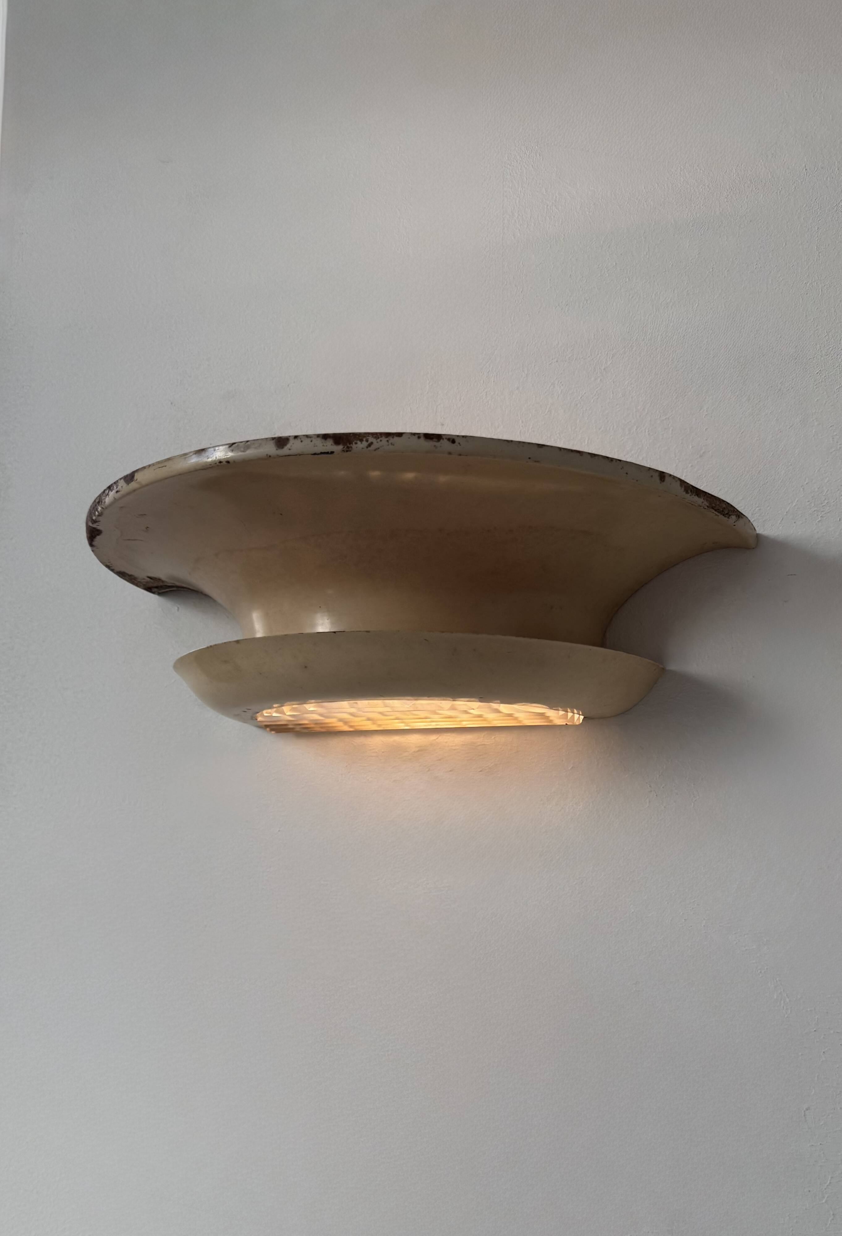 Pair of vintage modernist wall lights, beige painted metal and glass, France, 1930