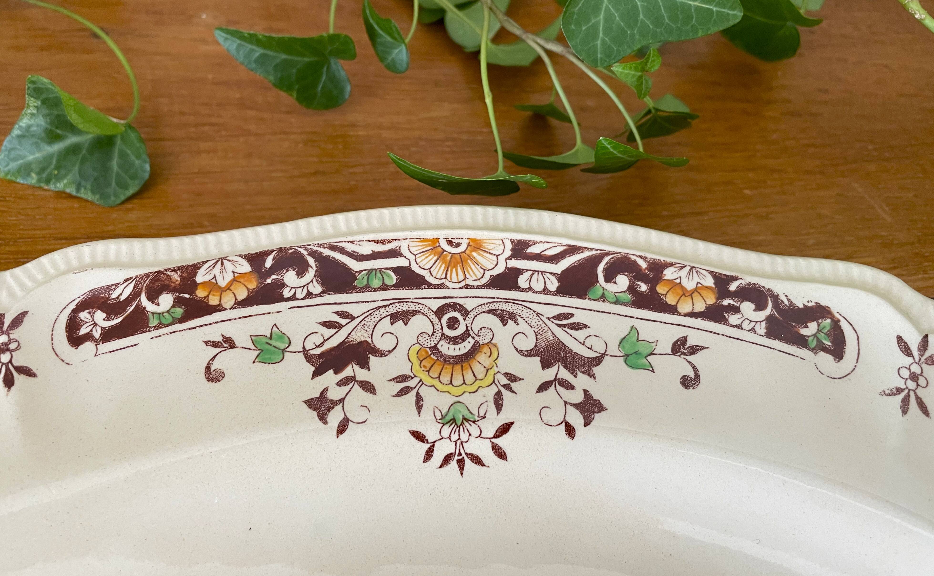 Antique serving dish in Longchamp earthenware.