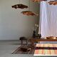 Large Indian rug with red, yellow, and white stripes and geometric fringes.