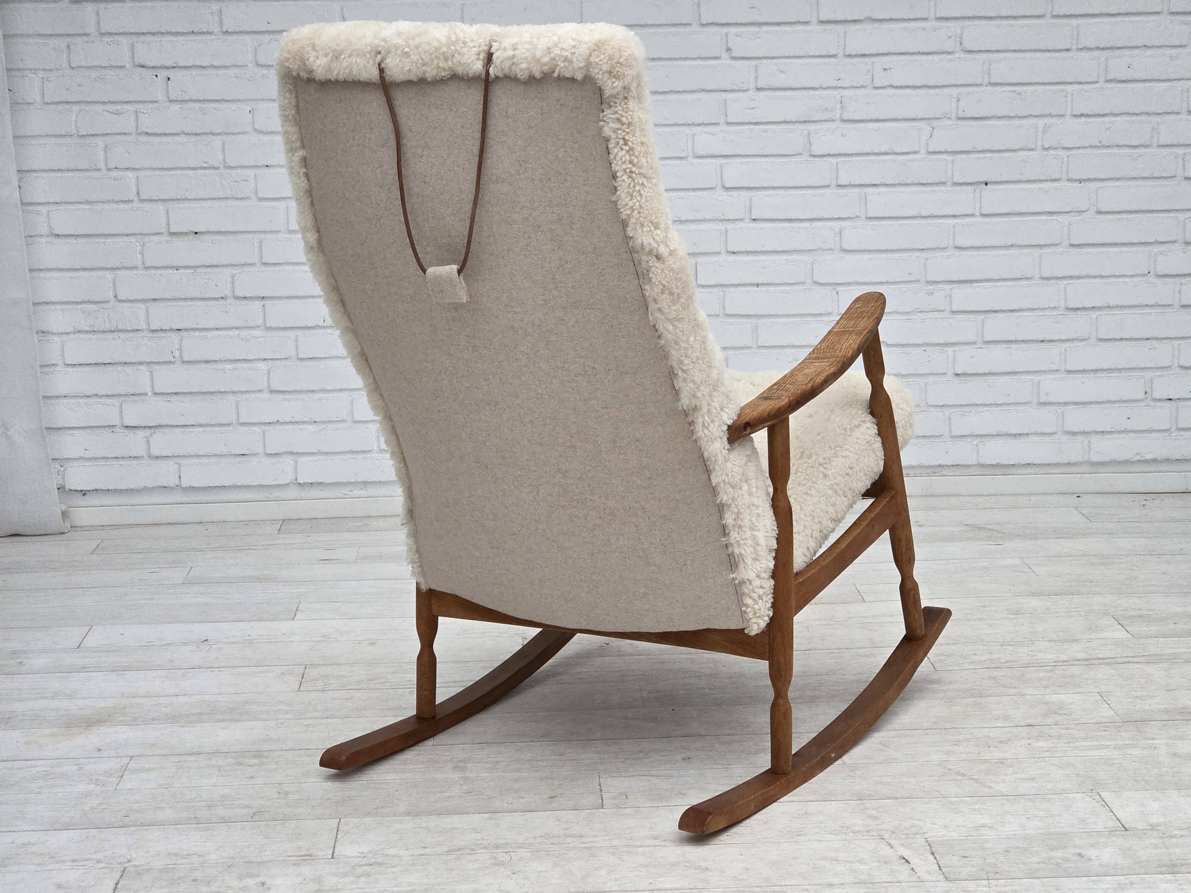 1970s, Danish rocking chair, reupholstered in quality genuine sheepskin.