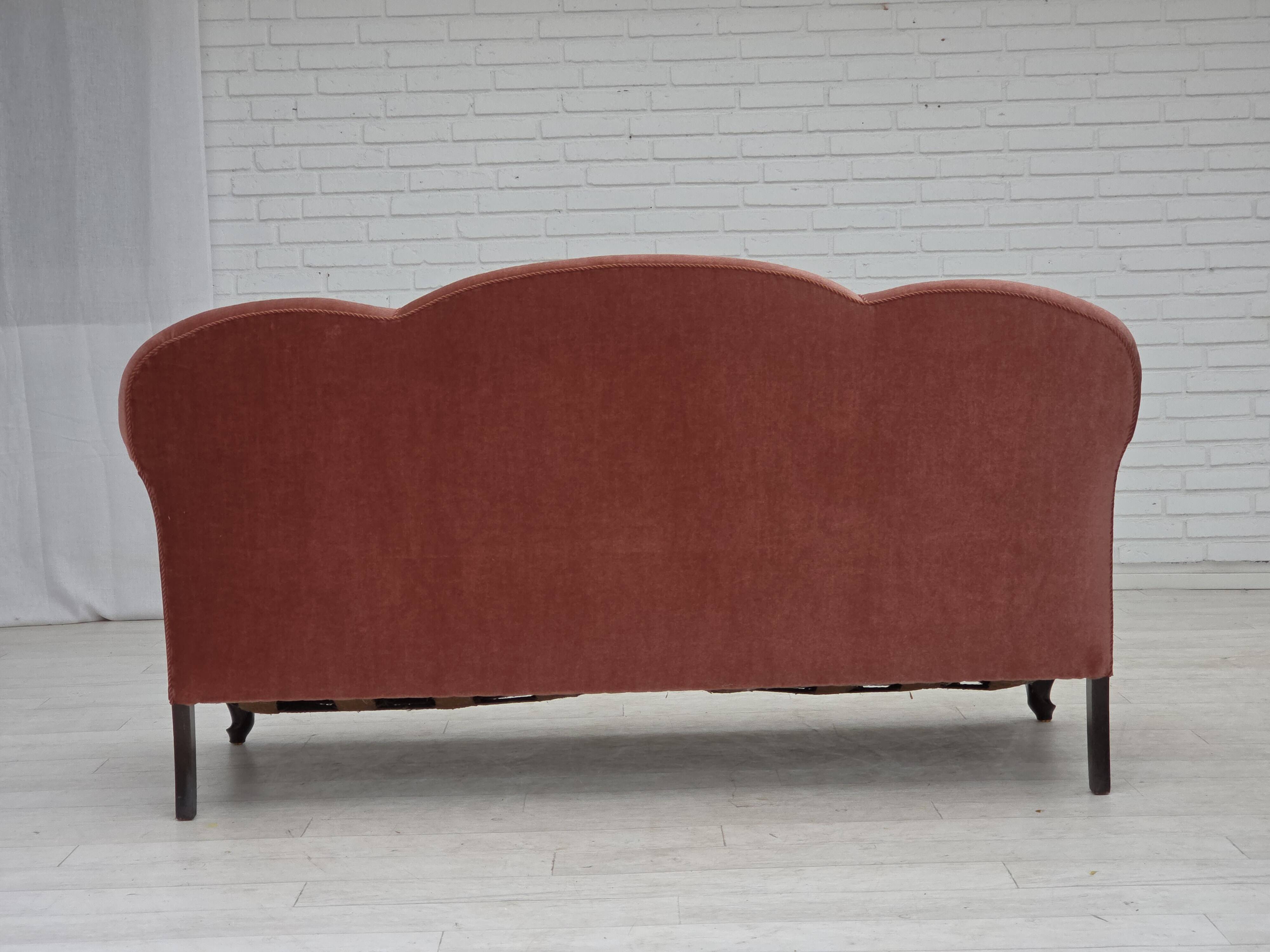 1950s, Danish 2-seater sofa, salmon pink furniture velour, oak wood legs.