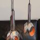 Massive Belgique three-armed waterfall pendant lamp in chrome and orange lacquer