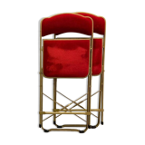 2 metal and red velvet chairs