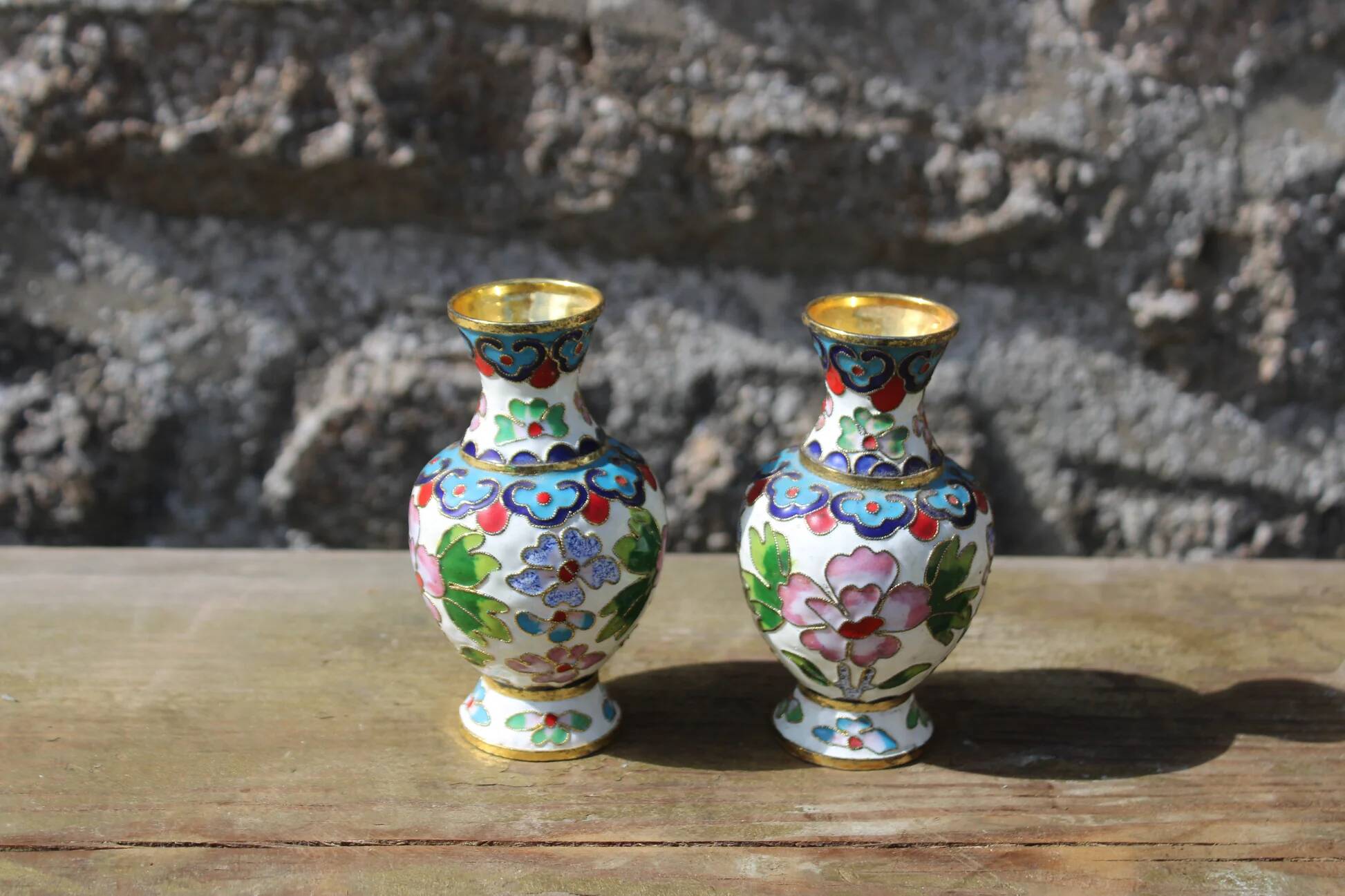 Two small vintage cloisonné enamel vases with Asian floral decoration.