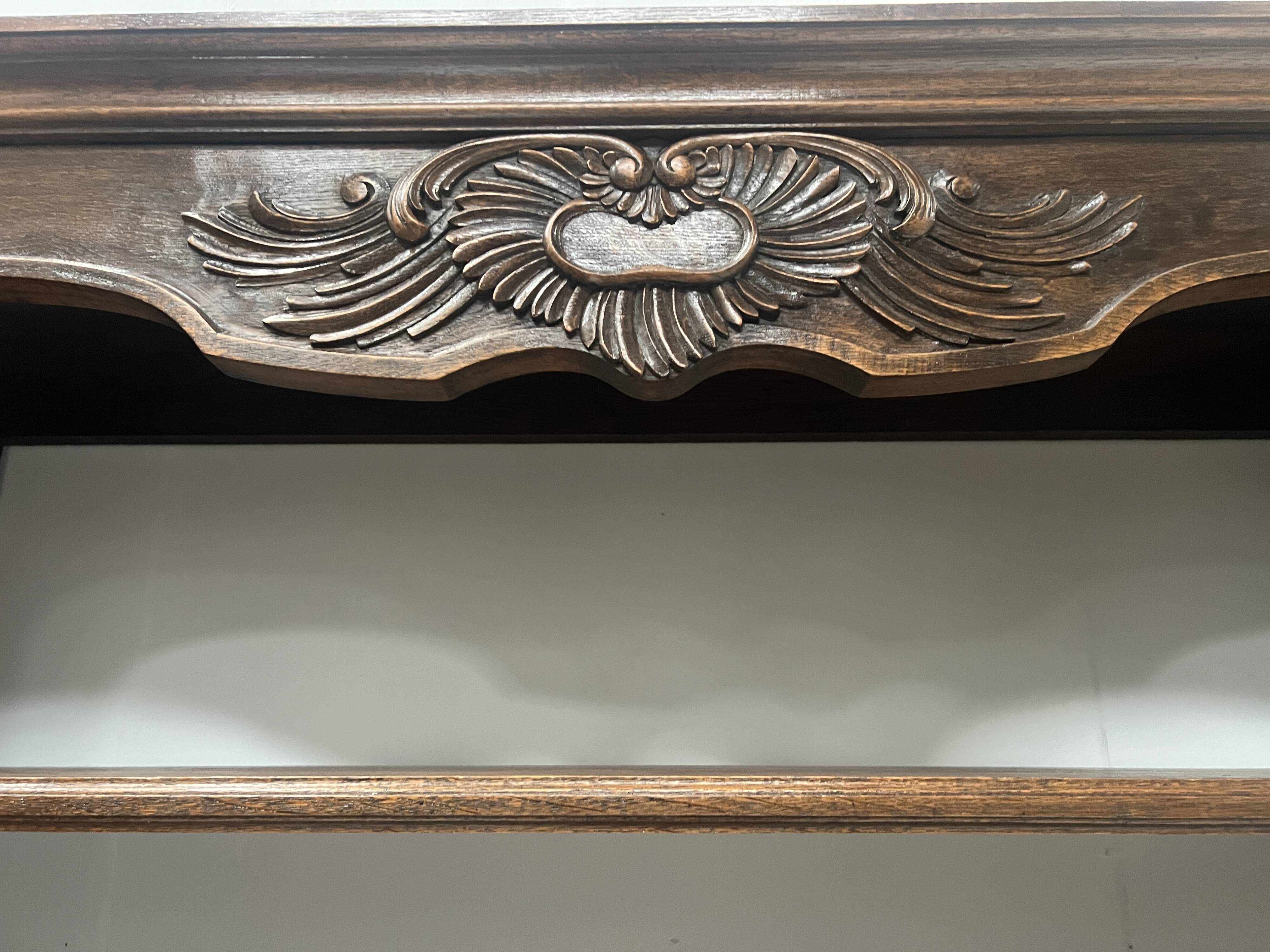Wall library in two sections in Louis XV style made of solid oak, 20th century.