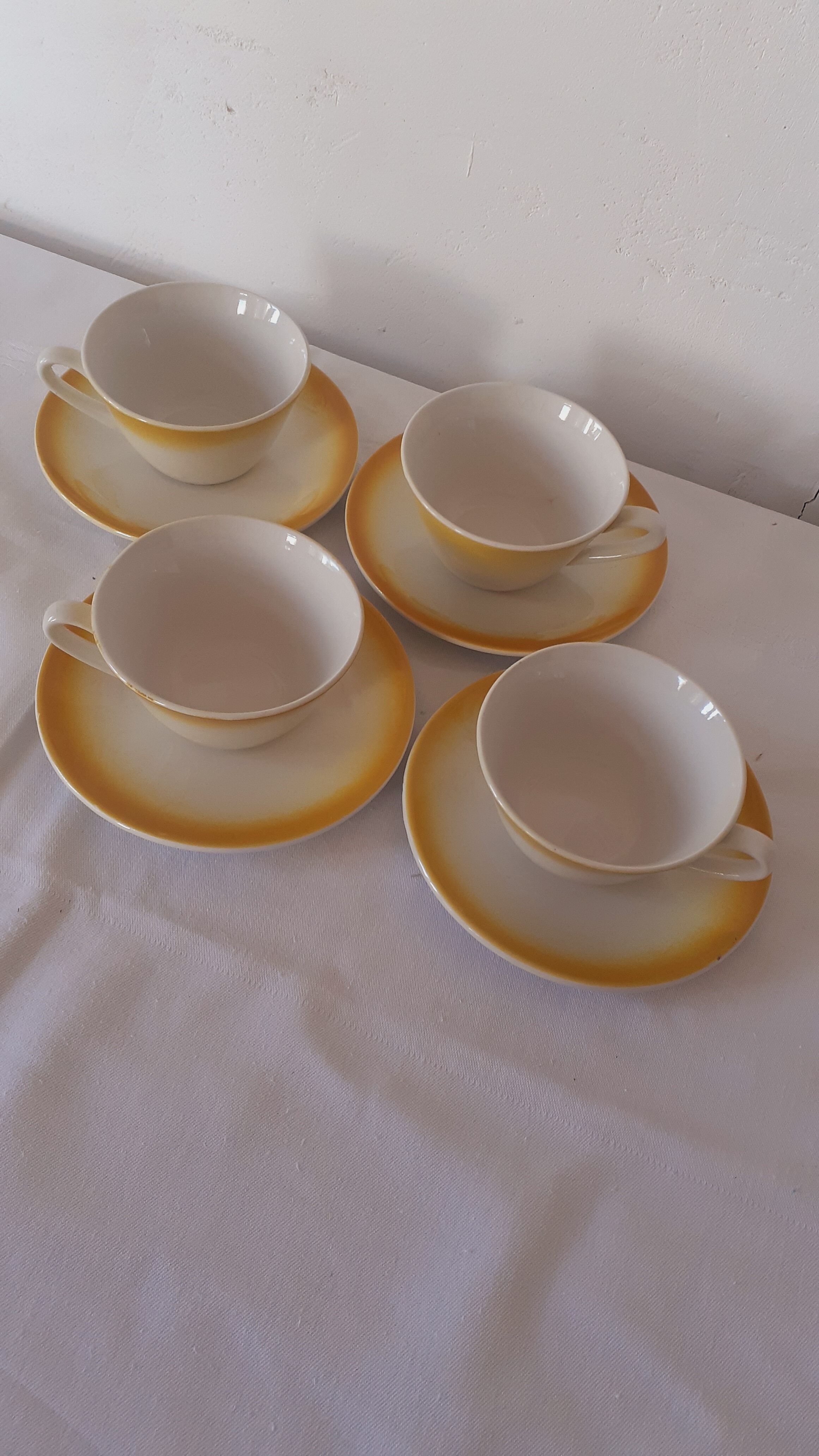 Yellow and white coffee cups