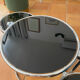 Coffee table with pivoting metal and black glass elements.