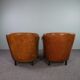 Set de 2 fauteuils Art Déco en cuir de mouton passepoil noir