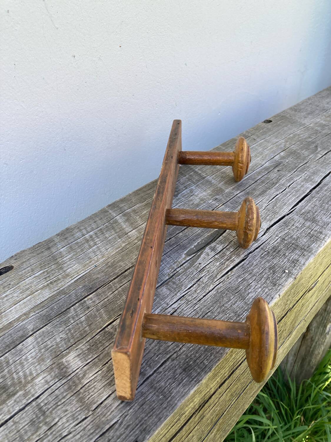 Old wooden wall coat rack