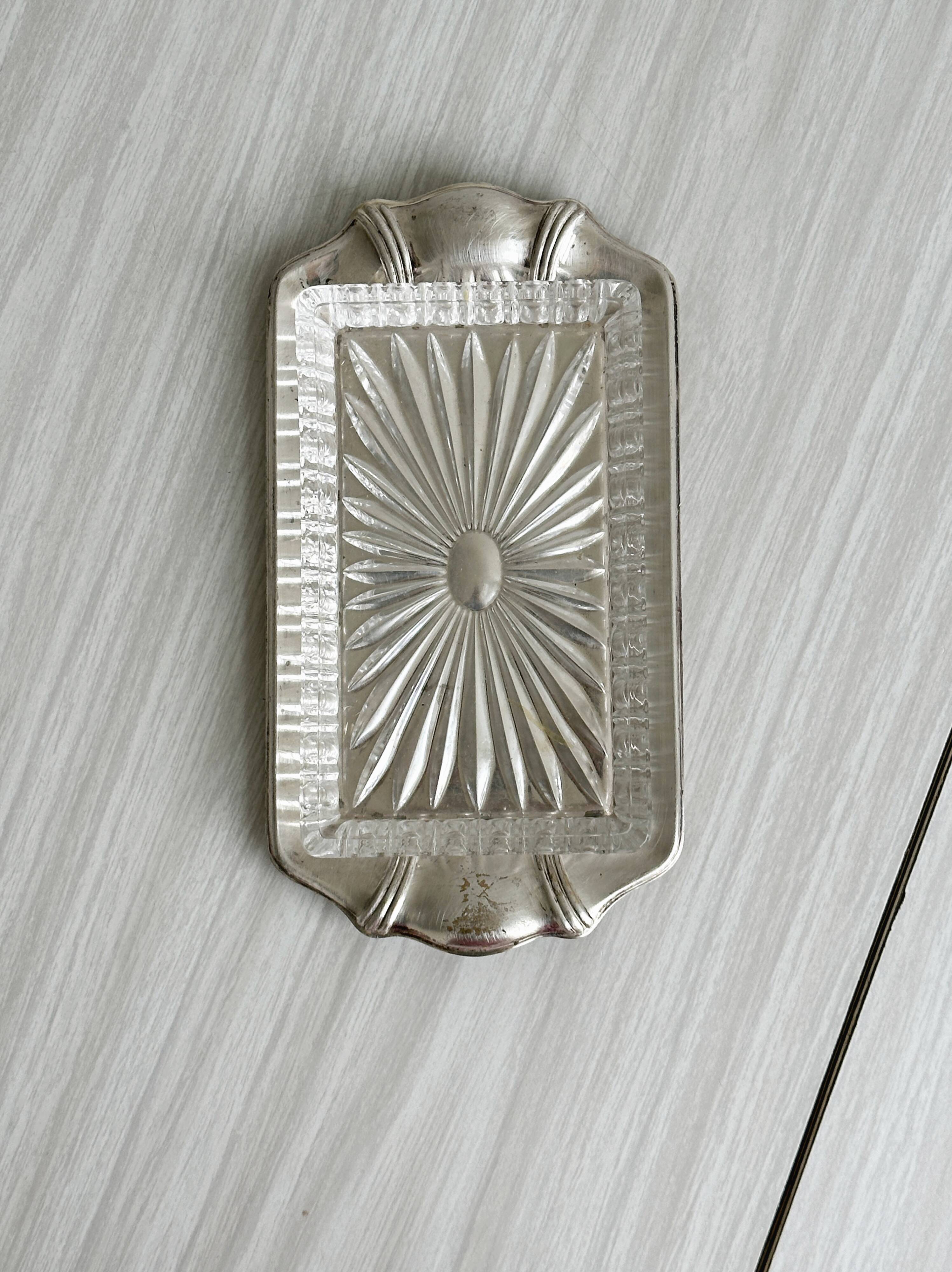 Metal butter dish and thick rectangular glass bowl.