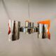 Hanging lamp in chromed metal with orange contrast lacquer and three light sources.