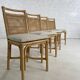 Suite de 4 chaises en rotin cannage et laiton