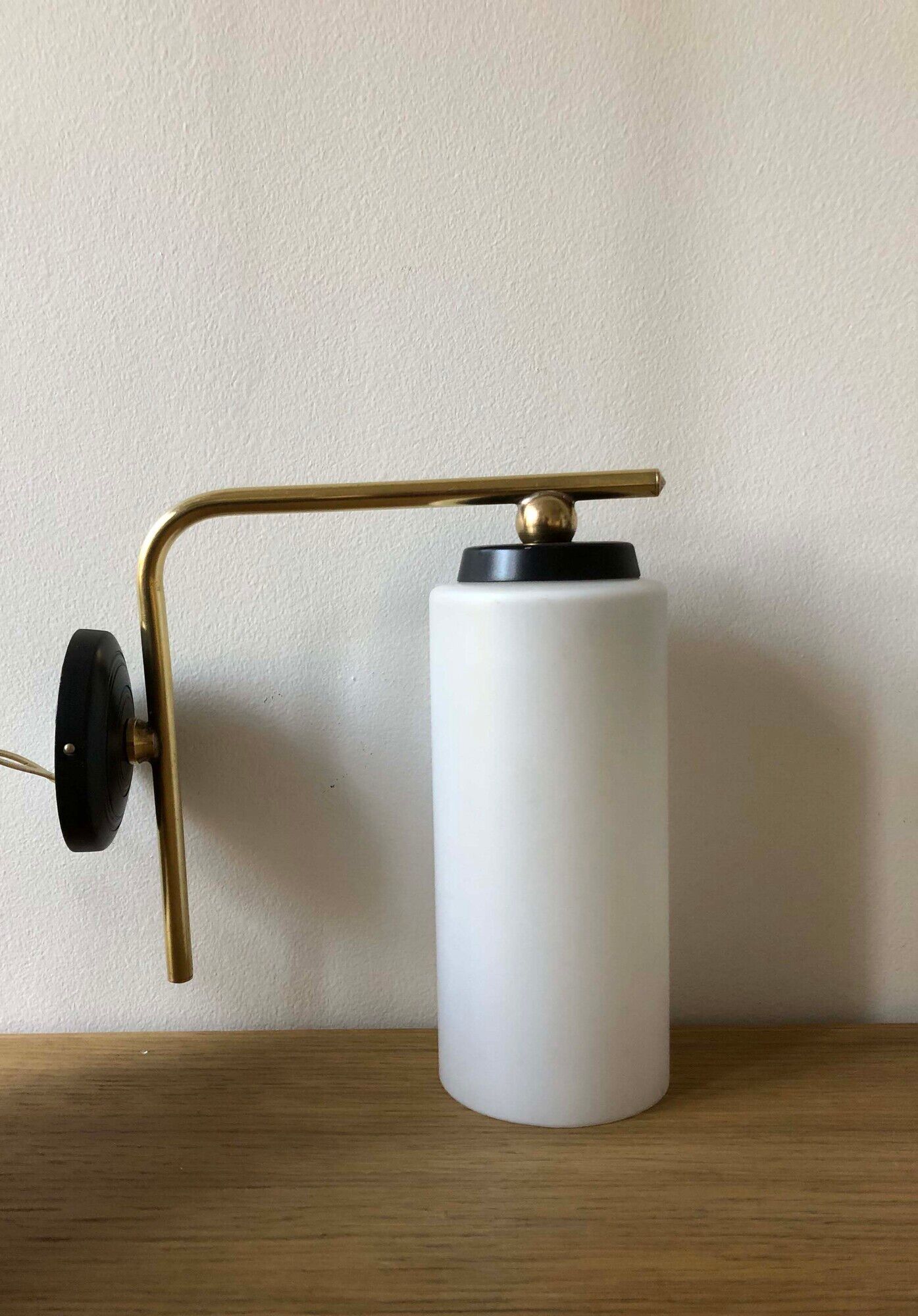 Pair of brass tube wall light and 1960s opalin glass