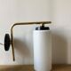 Pair of brass tube wall light and 1960s opalin glass