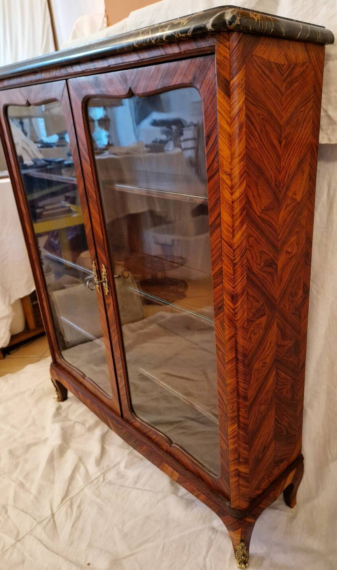 Napoleon III display cabinet in marquetry, Louis XV style, black marble, gilded bronze.