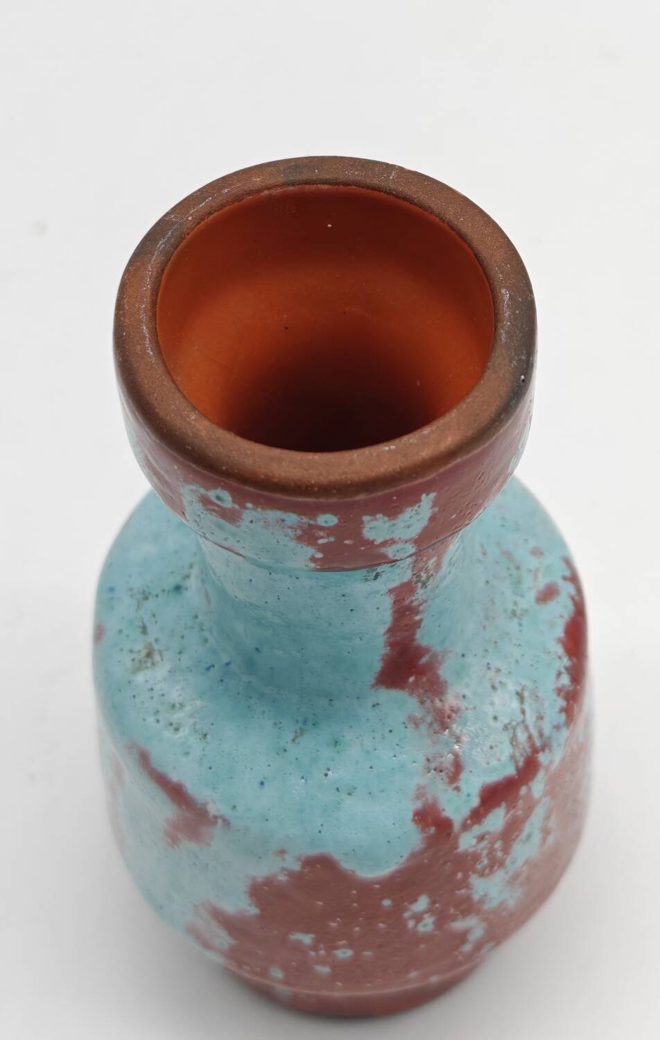Small designer vase in oxblood red and turquoise blue