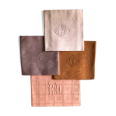 Set of four old damask towels dyed in multiple colors