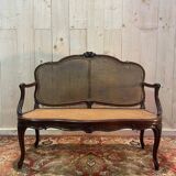 Louis XV mahogany and cane bench