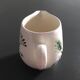 Signed floral decoration pitcher