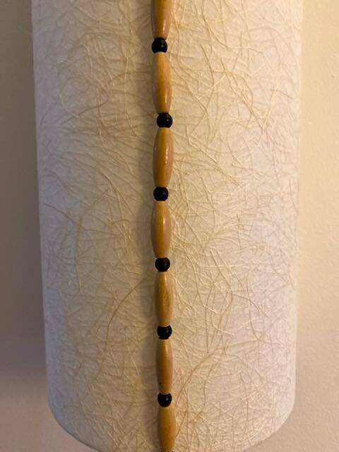 Long Japanese paper applique and bead cord.