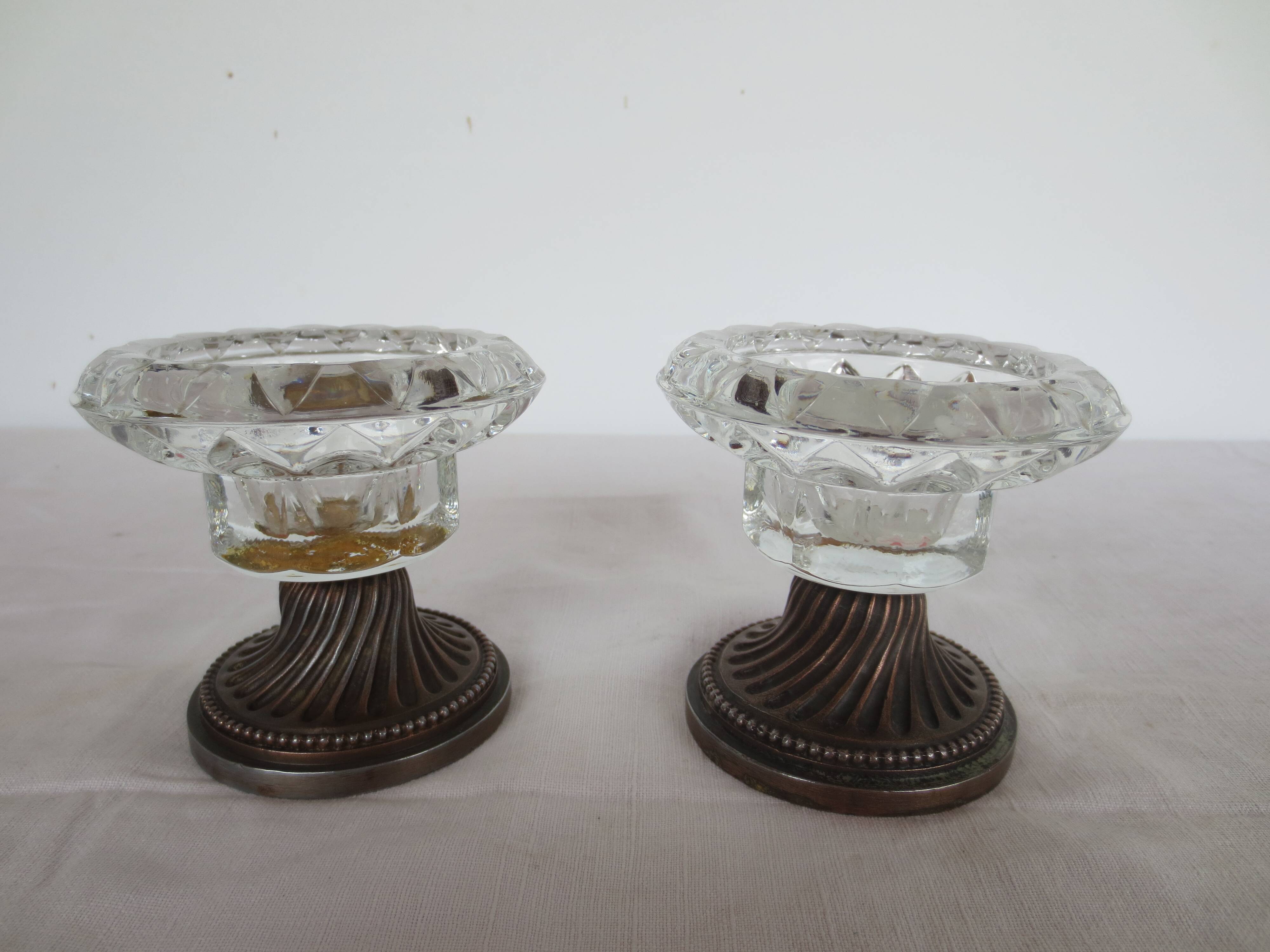 Two candle holders in bronze and crystal
